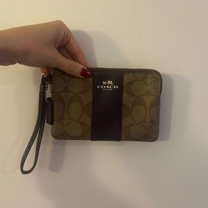 Coach wristlet in signature canvas, never worn — brown, maroon/purple